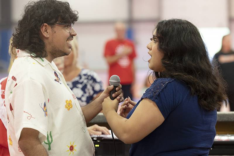 Raul Garcia and Ariana Diaz sing a duet of the national anthem Saturday, June 8, 2024 to start the Survivor’s Lap at the Relay for Life.