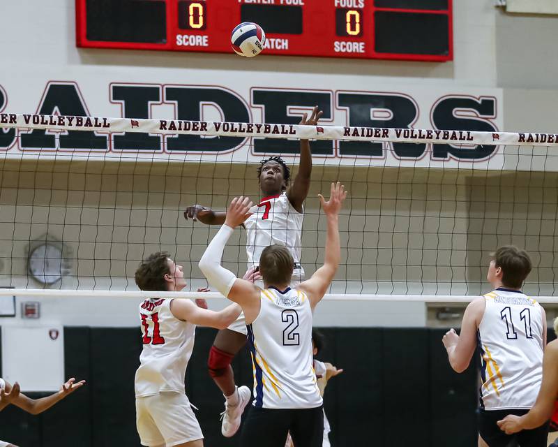 Bolingbrook's Tristan Benbow (7) leaps for a kill during volleyball match between Neuqua Valley at Bolingbrook.  April 1, 2024.