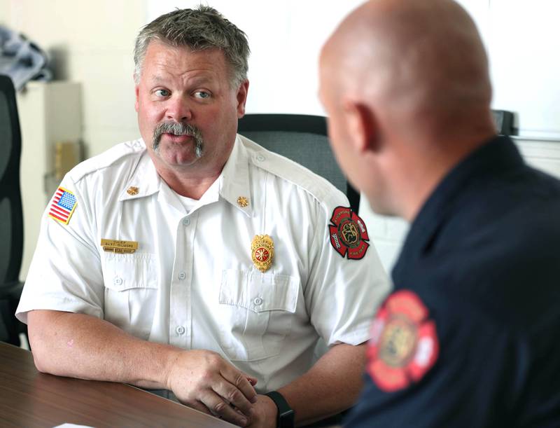 Sycamore Fire Chief Bart Gilmore (left) talks to Ian Wheeler, a firefighter/paramedic with the department, Tuesday, June 11, 2024, at Sycamore Fire Station 1.