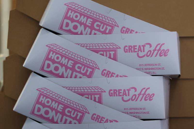 Boxes are stacked and ready on the counter for quick service at Home Cut Donuts on Jefferson Street, Saturday, March 25, 2023 in Joliet.