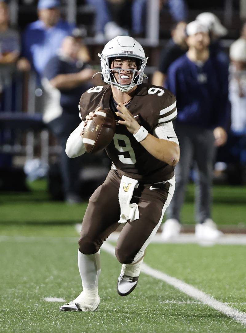 Mt. Carmel's Jack Elliott (9) looks for a receiver during the varsity football game between Nazareth Academy and Mt. Carmel high school on Friday, Sep. 13, 2024 in Chicago.