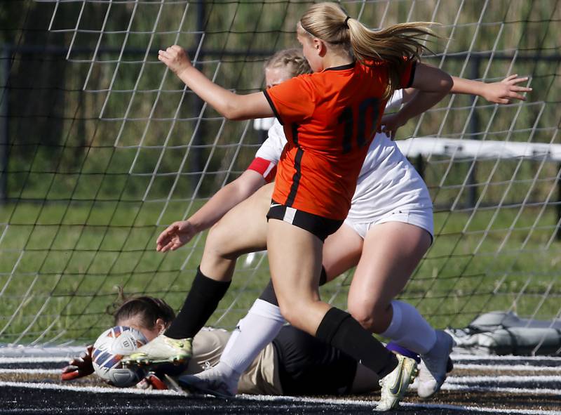 Crystal Lake Central's Brooklynn Carlson (right) kicks the ball into the goal in front of Wauconda's Lily Schmidt during the IHSA Class 2A Grayslake North Regional championship soccer match on Friday, May 17, 2024, at Grayslake North High School.