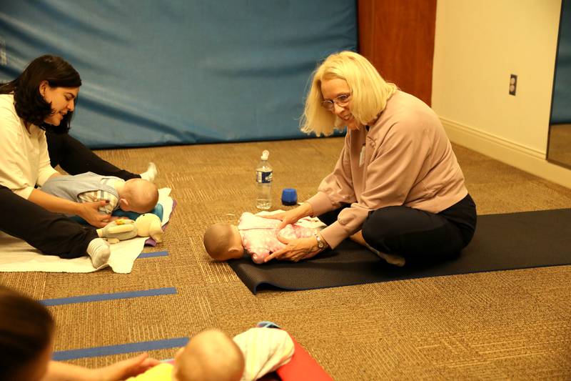 Patricia Ideran, a pediatric occupational therapist and certified in baby yoga and massage for Northwestern Medicine, teaches a baby yoga at Northwestern Medicine Central DuPage Hospital in Winfield.