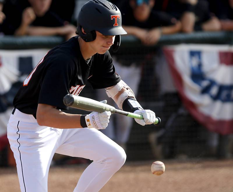 Crystal Lake Central's Wade Ozment lays down a bunt during a Class 3A Grayslake Central sectional championship baseball game against Deerfield on Friday, May 31, 2024, at the Grayslake Central High School.