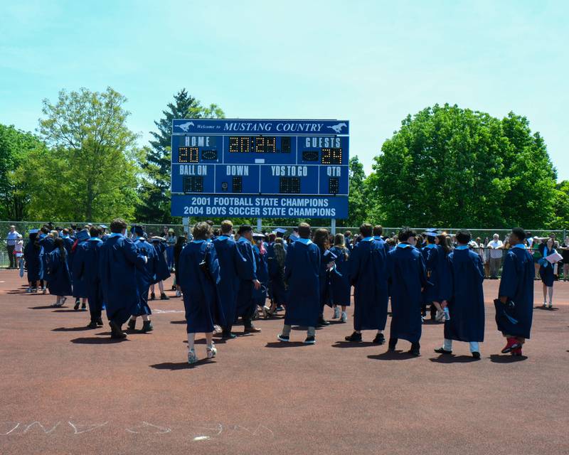 Downers Grove South Seniors pick up their diplomas after going through graduation at Downers Grove South High School that was held on Sunday May 19, 2024.