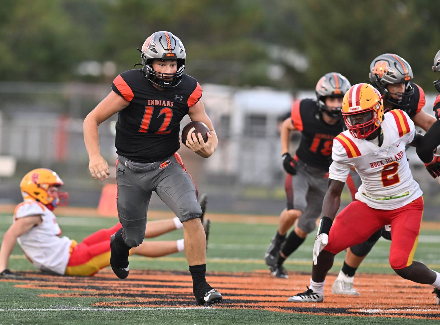 Minooka's Nathan Maul scrabbles for a big gain  during a non-conference game against Rock Island on Friday, Aug. 25, 2023, at Minooka. (Dean Reid for Shaw Local News Network)