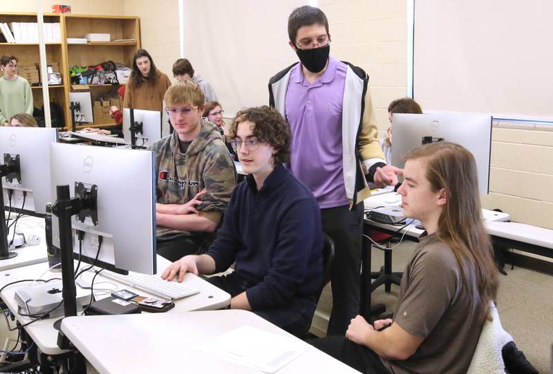 Educator Gregory D'Addario, who teaches TV production and english and Spartan TV at Sycamore High School, goes over some ideas for a movie scene recreation with students in his class Wednesday, March 1, 2023, at the school.