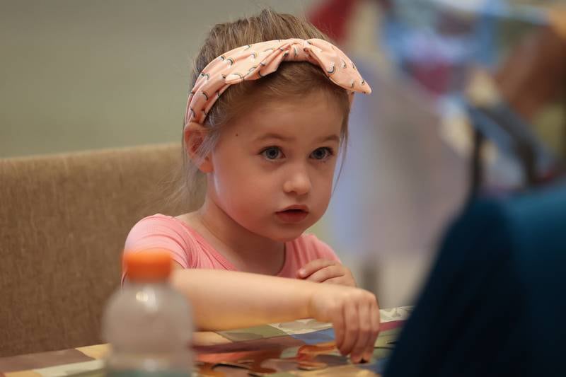 Claire McCluskey, 4-years-old, makes a royal crown at the Royal Faire hosted by the Joliet Public Library Black Road Branch on Saturday, July 22nd, 2023.