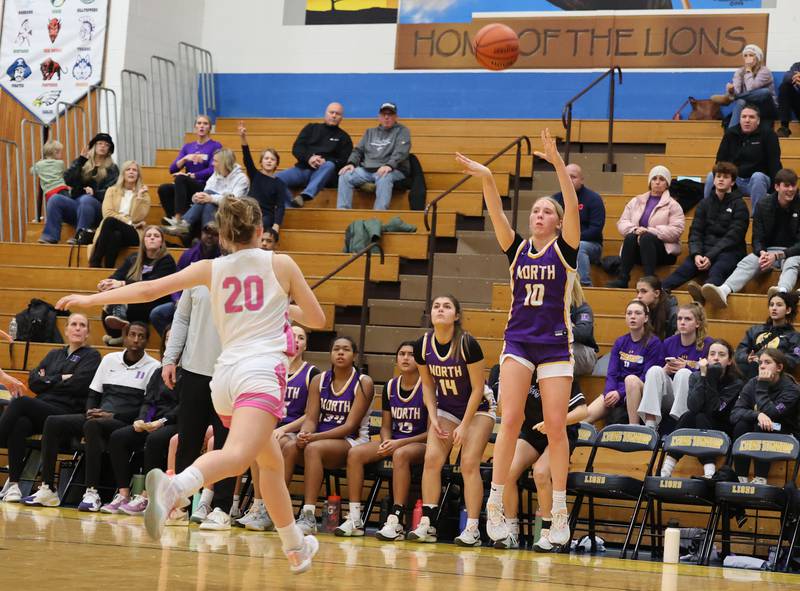 Downers Grove North’s Hope Sebek (10) takes a three-point shot against Lyons Township during the girls varsity basketball game on Tuesday, Jan. 16, 2024 in La Grange, IL.