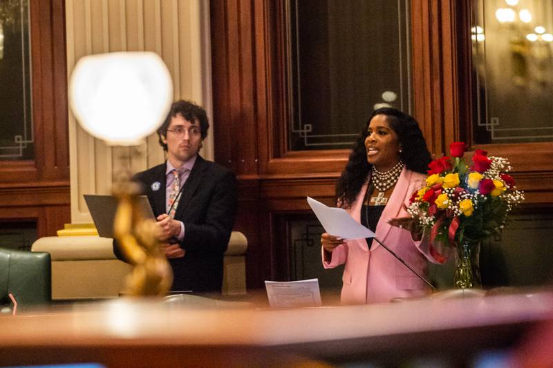 Brady Burden, a member of House Speaker Emanuel “Chris” Welch’s staff, accompanies Rep. Jehan Gordon-Booth, D-Peoria, during floor debate of the budget bill early Wednesday morning. Burden and the Illinois Legislative Staff Association, which is a group of House employees that are seeking to unionize, filed suit against Welch Friday.