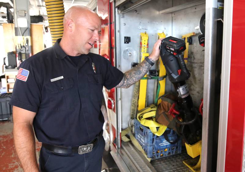 Ian Wheeler, a Sycamore firefighter/paramedic, goes through some of the gear on one of the engines Tuesday, June 11, 2024, at Sycamore Fire Station 1.