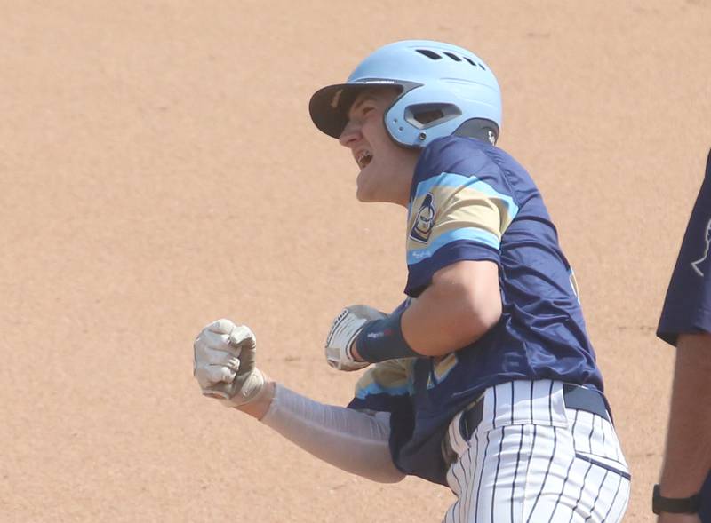 Marquette's Griffin Dobberstein reacts on base while getting a hit against Routt during the Class 1A semifinal game on Friday, May 31, 2024 at Dozer Park in Peoria.