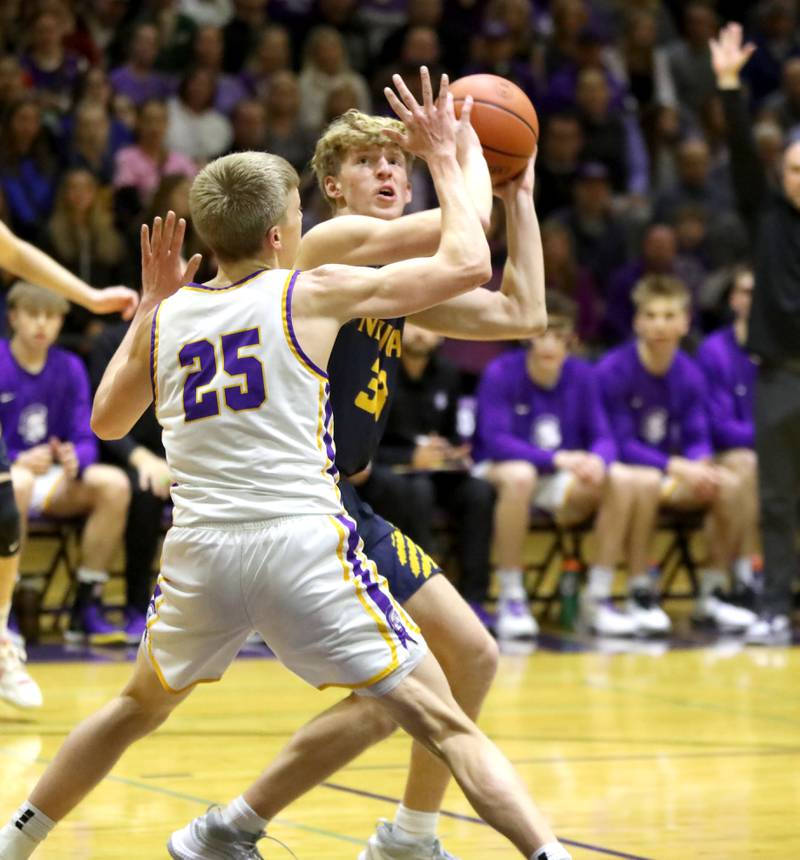 Neuqua Valley’s Joe Balgro looks for a shot around Downers Grove North’s Alex Miller during the Class 4A Downers Grove North Regional final on Friday, Feb. 23, 2024.