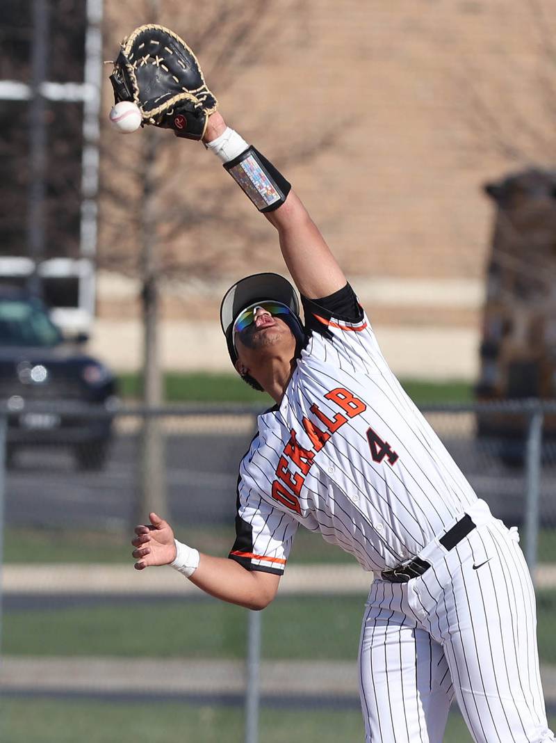 DeKalb's Maddux Clarence tries to catch an infield fly ball during their game against Metea Valley Thursday, April 13, 2023, at DeKalb High School.