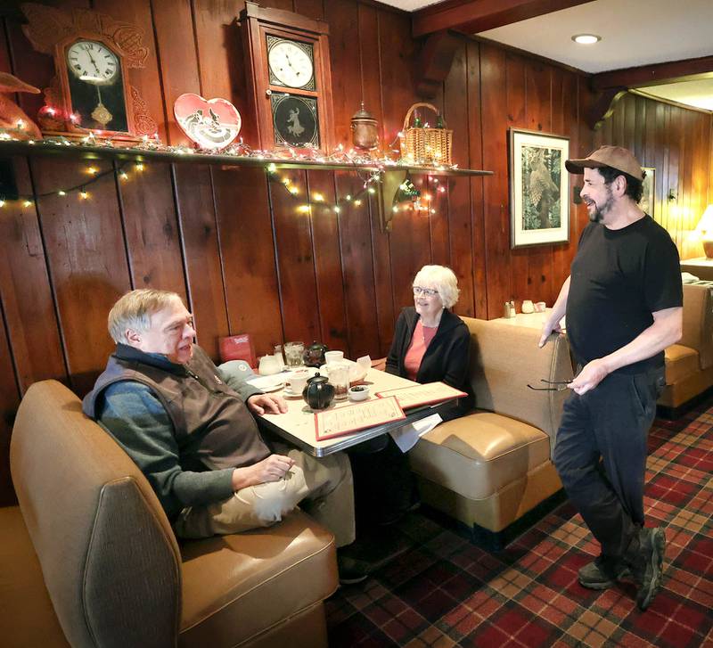 The Hillside Restaurant owner Gavin Wilson (right) talks to regulars Vincent Boone and Vicki Erwin, of DeKalb, Wednesday, Feb. 22, 2023, at eatery in DeKalb. Hillside will soon be closing its doors after 68 years in business.