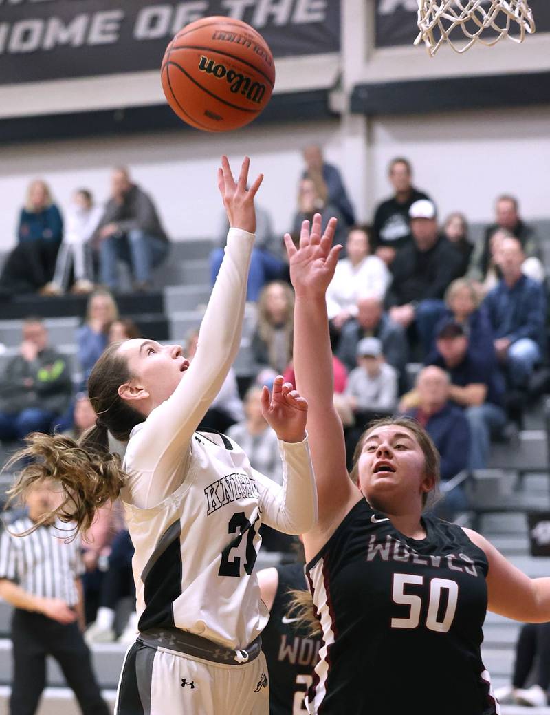 Kaneland's Kyra Lilly shoots over Prairie Ridge's Grace Wolf Thursday, Feb 15, 2024, during their Class 3A regional final game at Kaneland High School in Maple Park.