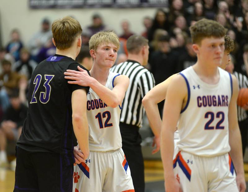 Eastland's Adam Awender (12 ) and Pecatonica's Jaxon Diedrich (23) meet as Awender leaves the game late in the fourth quarter in the Cougars' loss to the Indians at the championship game of the 1A River Ridge sectional on Friday, March 1, 2024 in Hanover.