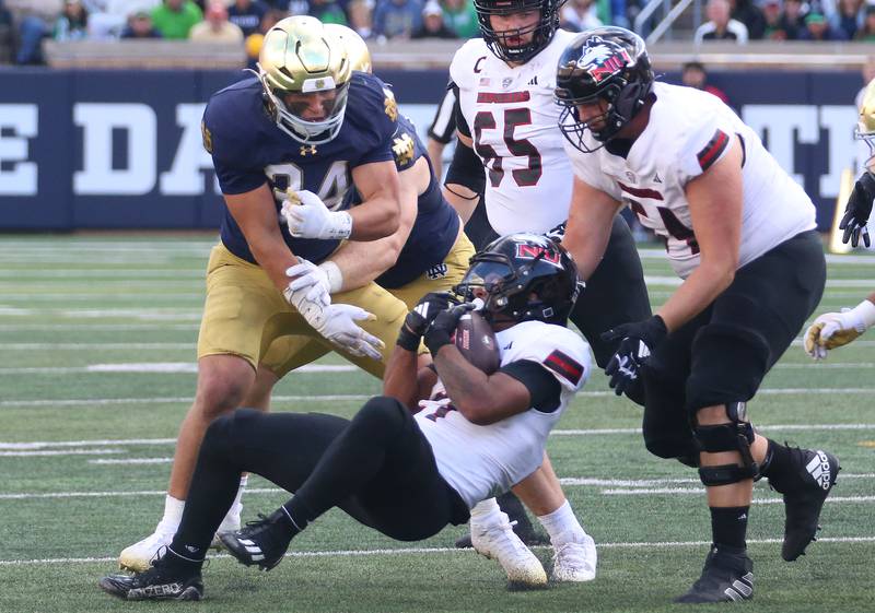 NIU's Dev'ion Reynolds spins around Notre Dame's Drayk Bowen on Saturday, Sept. 7, 2024 at Notre Dame Stadium.