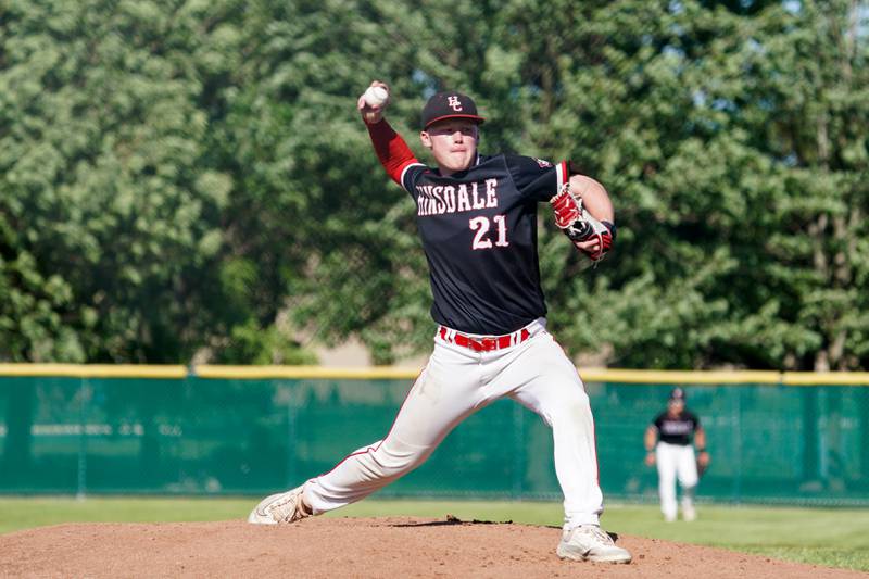 Hinsdale Central's Aidan Conners (21) delivers a pitch against Oswego during a Class 4A Waubonsie Valley Regional semifinal baseball game at Waubonsie Valley High School in Aurora on Wednesday, May 22, 2024.