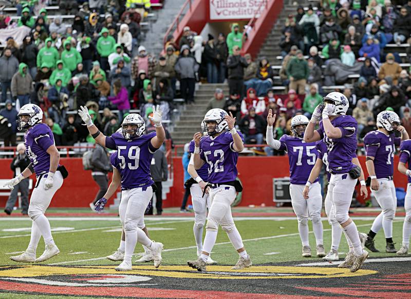 The Wilmington Wildcats celebrate their 28-3 win over Athens Friday, Nov. 24, 2023 in the 2A state football championship game at Hancock Stadium in Normal.