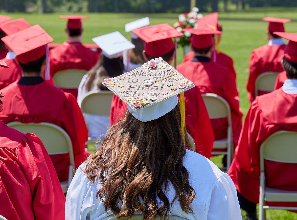 A Hall High School graduate's cap reads 