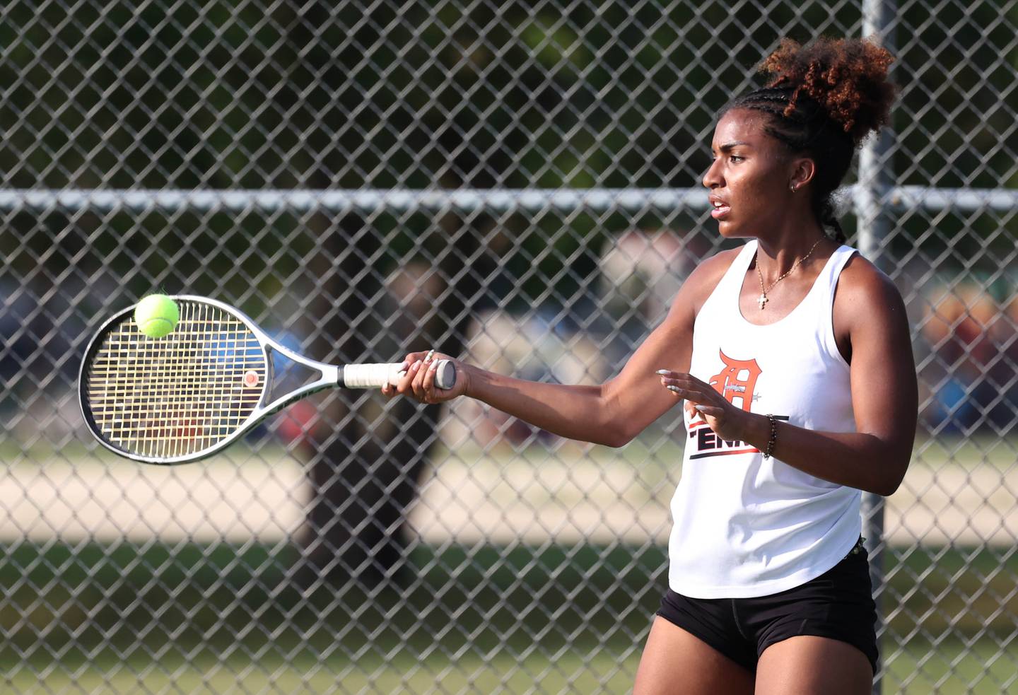 DeKalb’s Krystal Baggett hits a forehand during her match against Sycamore Wednesday, Sept. 18, 2024, at Sycamore High School.