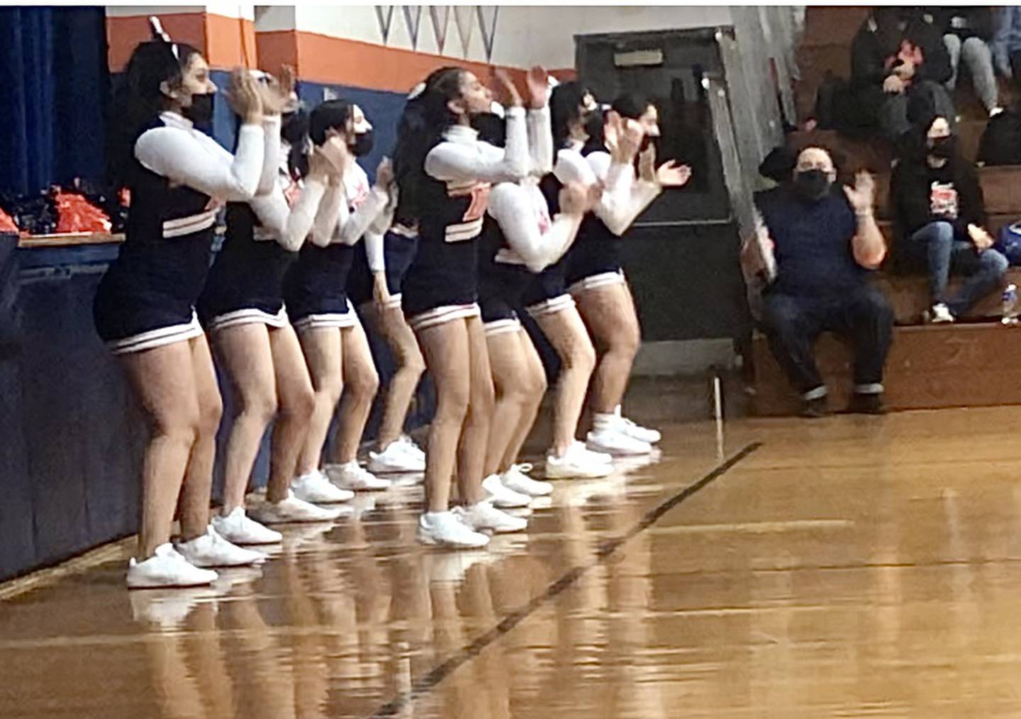 Tom Miller, K-12 music teacher at DePue Schools, keeps the beat as the cheer sponsor for the Little Giants cheerleader He took the job because they had no one else to turn to.