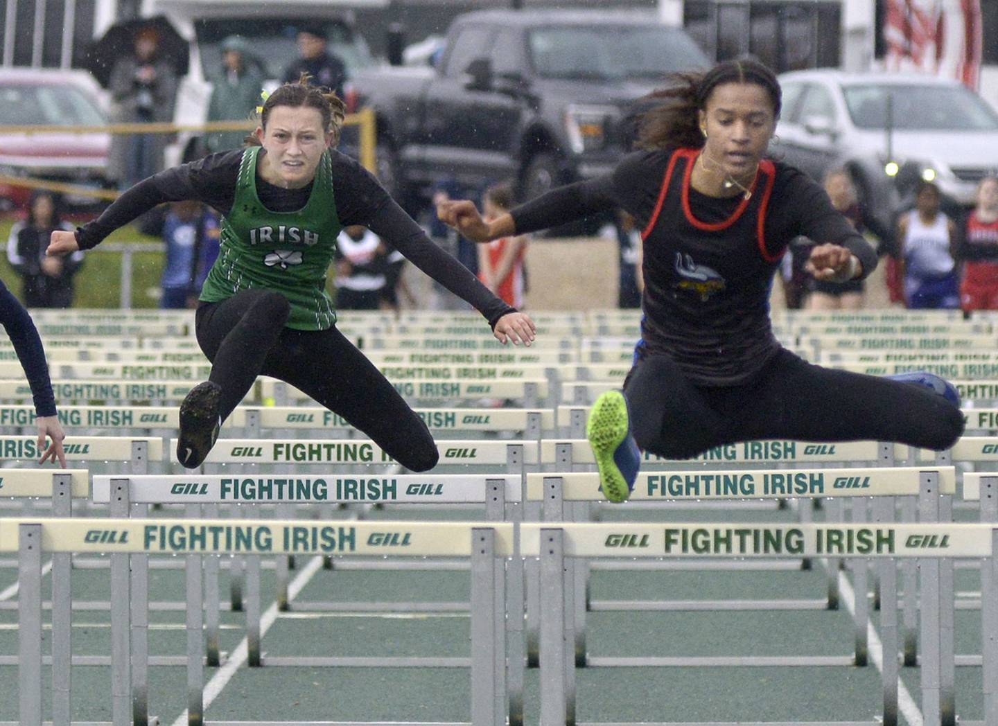 Seneca’s Lilly Pfeifer and Newark’s Kiara Wesseh compete in the 100-meter hurdles Thursday’s sectional at Seneca.