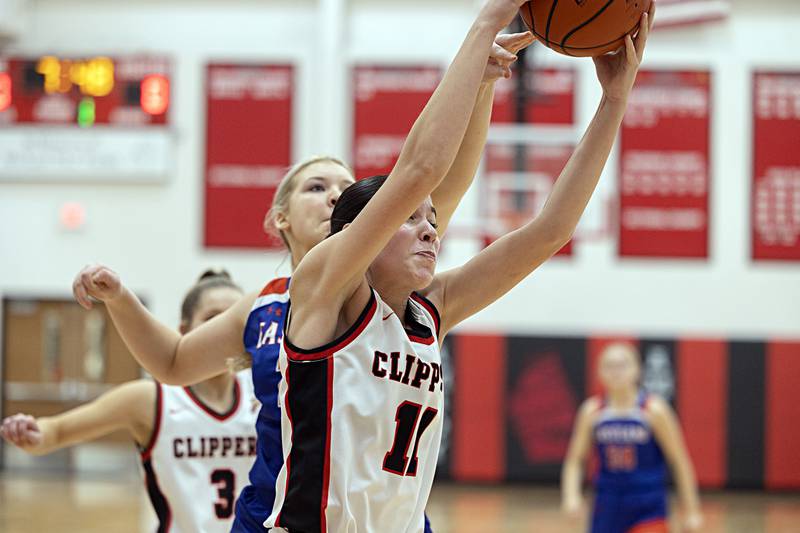 Amboy’s Tyrah Vaessen pulls down a rebound against Eastland Friday, Jan. 19, 2024 at Amboy High School.