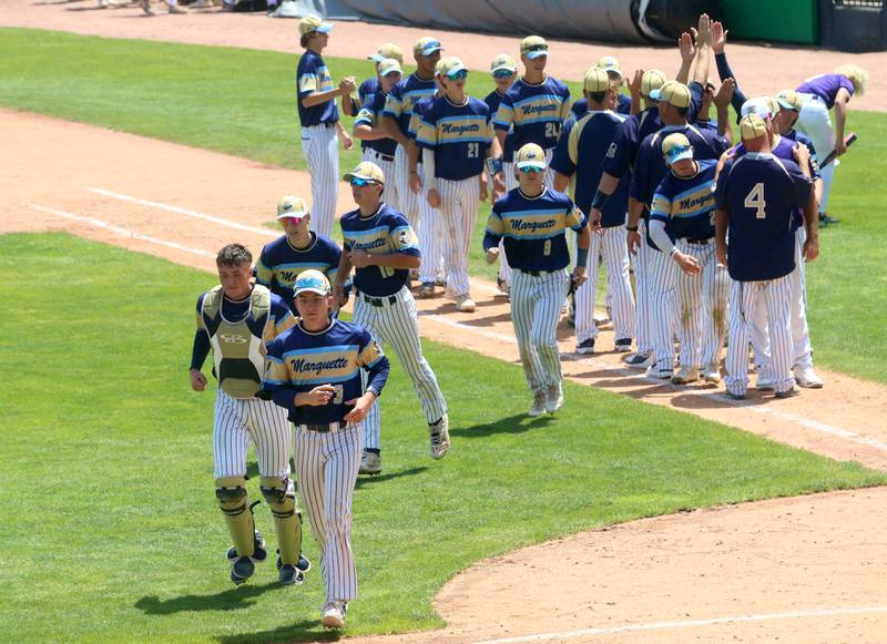 Members of the Marquette baseball team run off of the field after defeating Routt during the Class 1A semifinal game on Friday, May 31, 2024 at Dozer Park in Peoria.