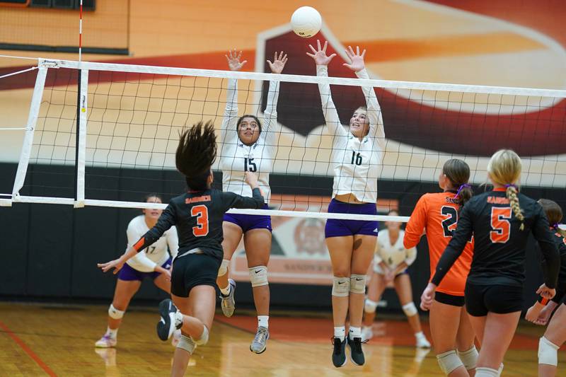 Plano's Camila Nunez (15) and Plano's Chloe Rowe (16) defend the net against a kill attempt by Sandwich's Jordan Bauer (3) during a volleyball match at Sandwich High School on Tuesday, Sep 10, 2024.