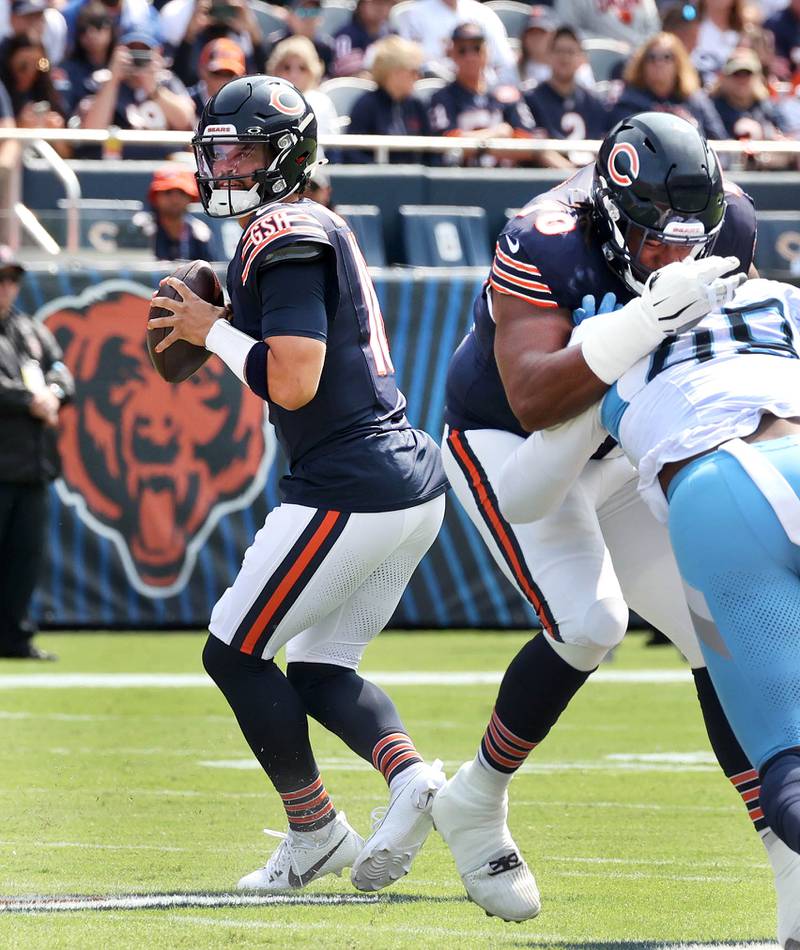 Chicago Bears quarterback Caleb Williams looks for a receiver in the Tennessee Titans secondary during their game Sunday, Sept. 8, 2024, at Soldier Field in Chicago.