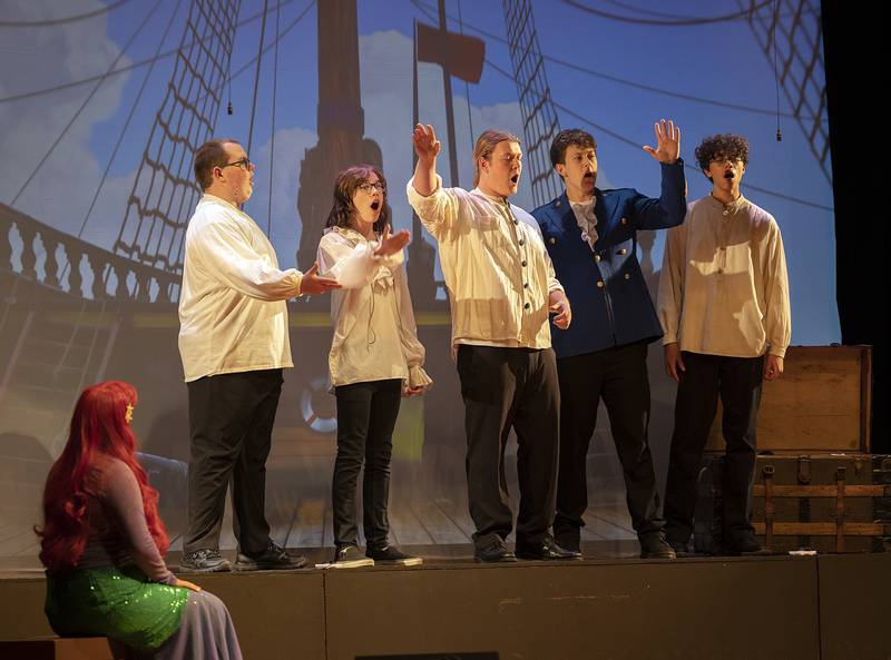 A cast of singers performs the song “Fathoms Below” Friday, April 26, 2024, during Fulton High School’s “The Little Mermaid.”