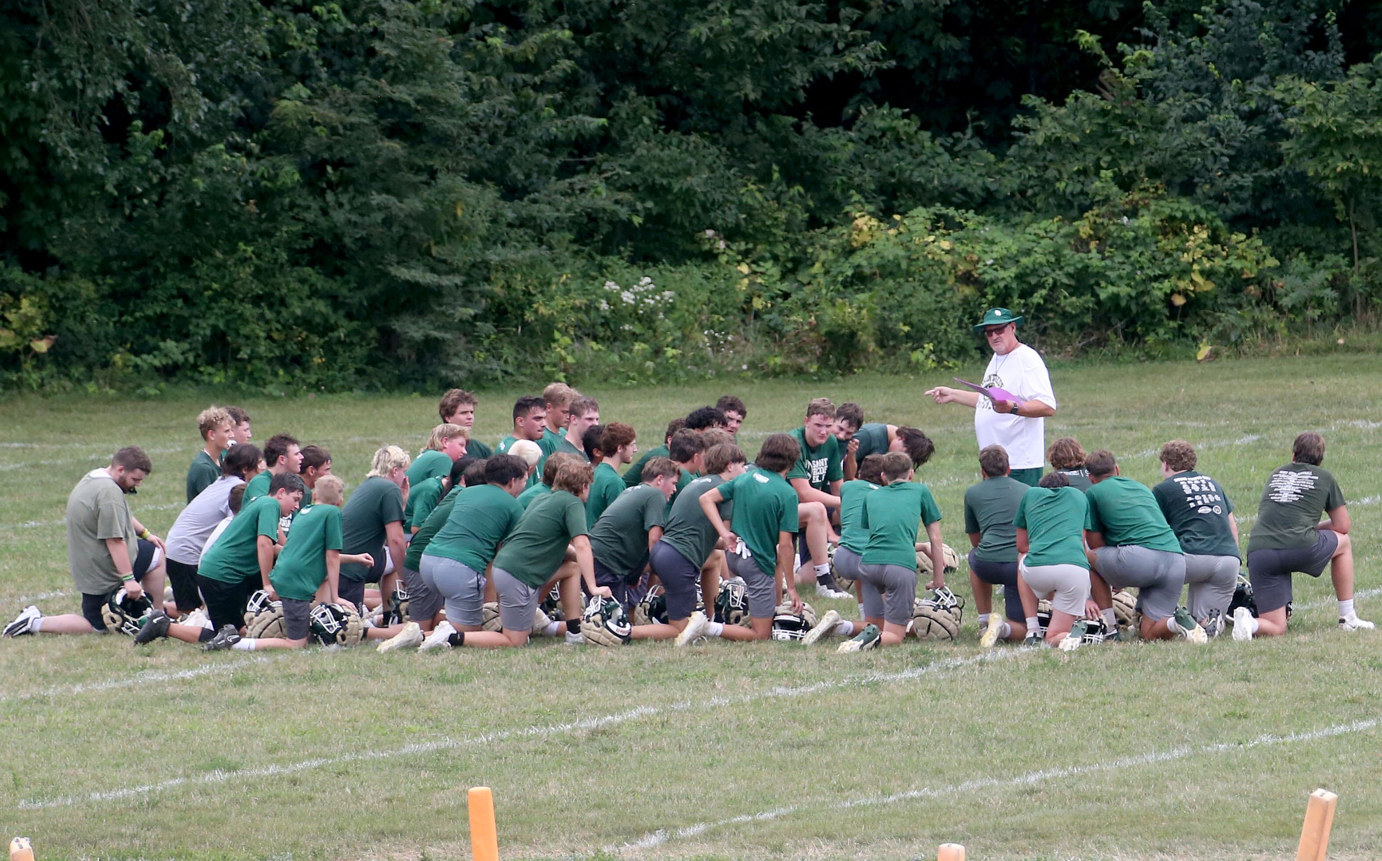 St. Bede head football coach Jim Eustice addresses his team during the first day of football practice on Monday, Aug. 24, 2024 at St. Bede Academy.