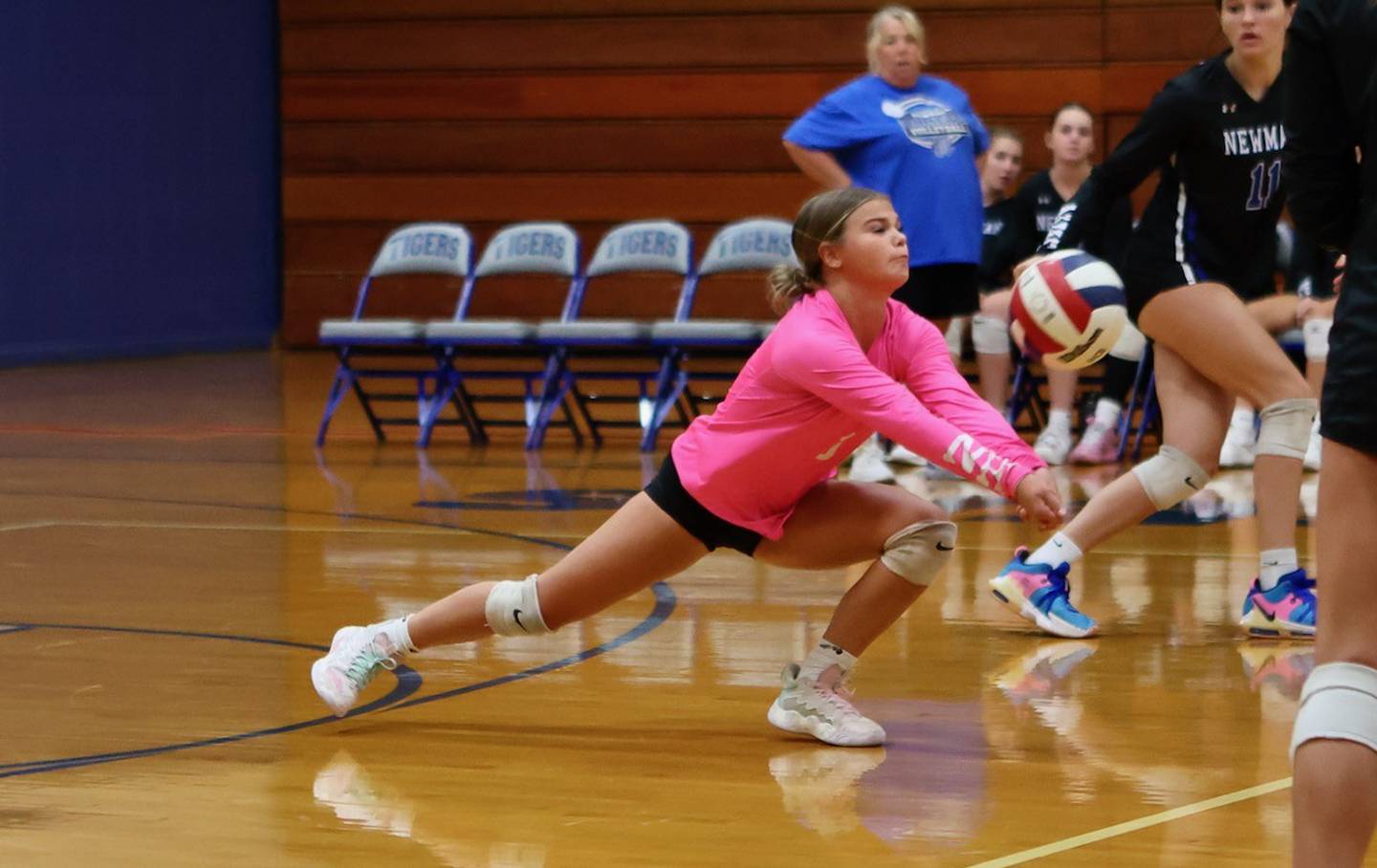 Newman libero Blair Grennan gets a pass up Tuesday night at Prouty Gym.