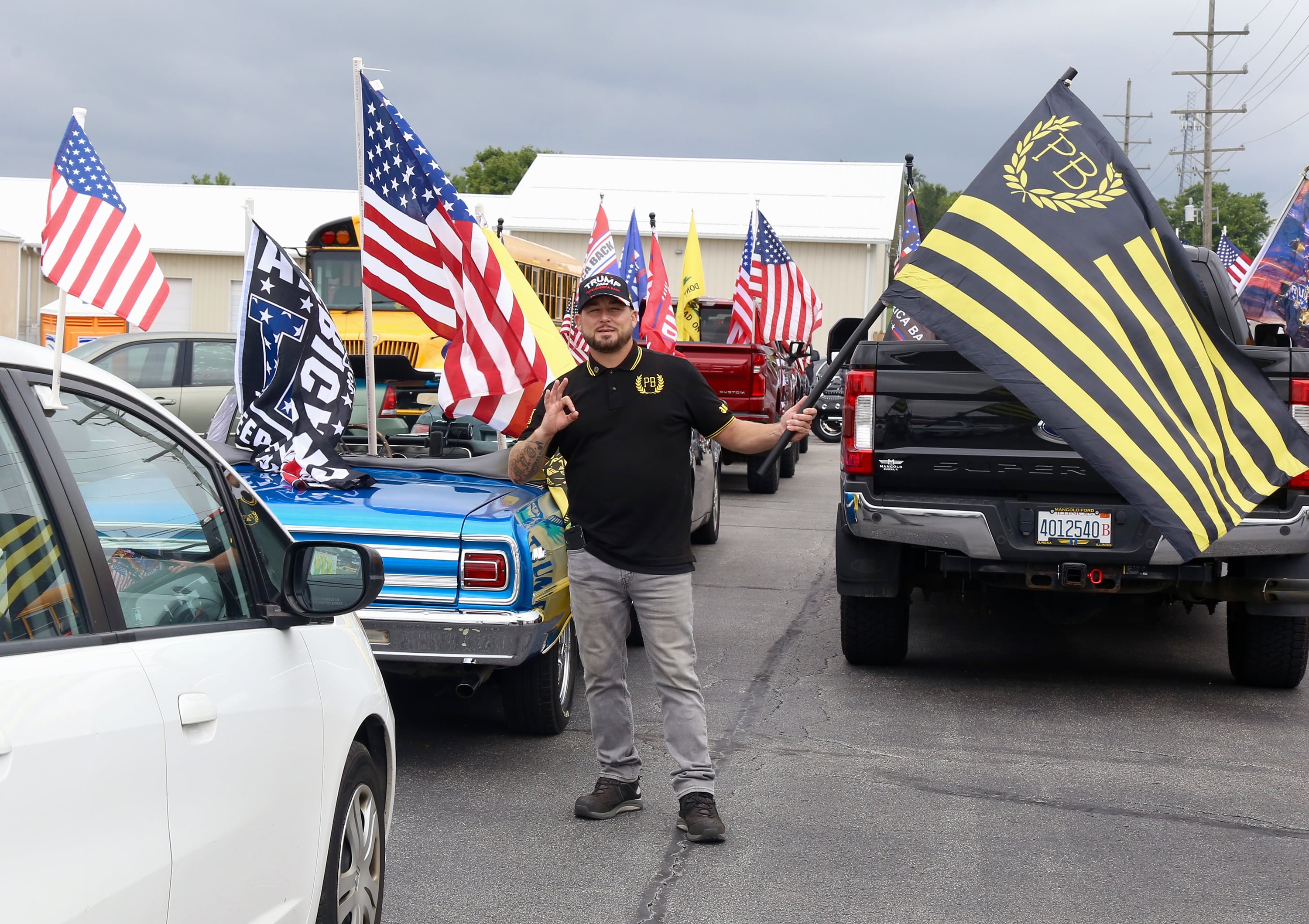 Guy Alexander, a supporter of President Trump gathers with other supporters on Sunday, Aug. 18, 2024 in Lily Lake before participating in a caravan to a rally in Woodstock.