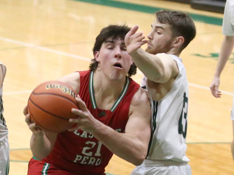 L-P's Josh Senica runs in the lane as St. Bede's Mason Ross defends on Wednesday, Feb. 14, 2024 at St. Bede Academy.