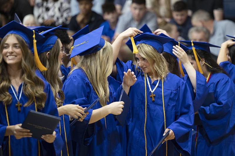 Newman grads flip their tassels Wednesday, May 15, 2024 at the end of commencement.
