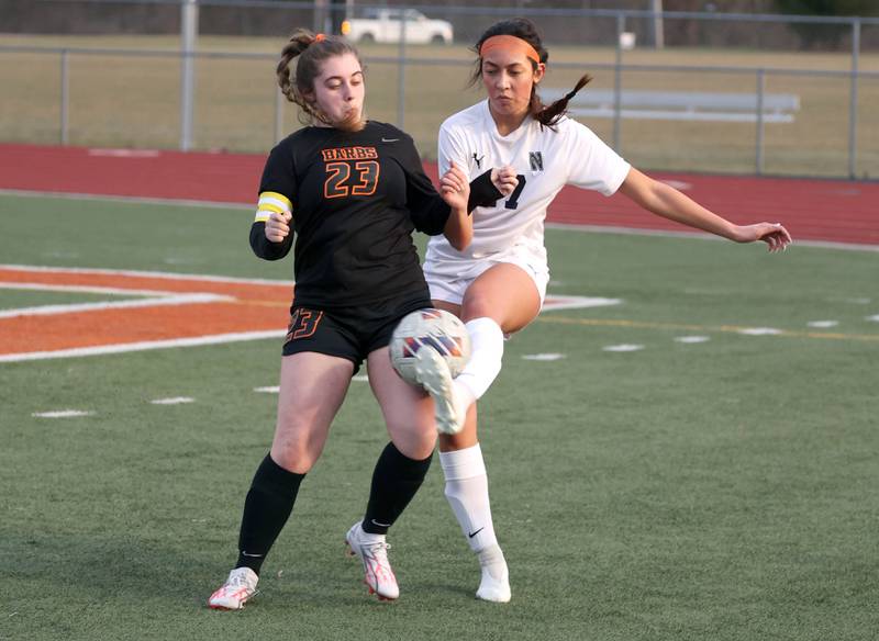 DeKalb’s Addison Elshoff and Belvidere North's Isabella  Phommachanh go after the ball during their game Tuesday, March 12, 2024, at DeKalb High School.