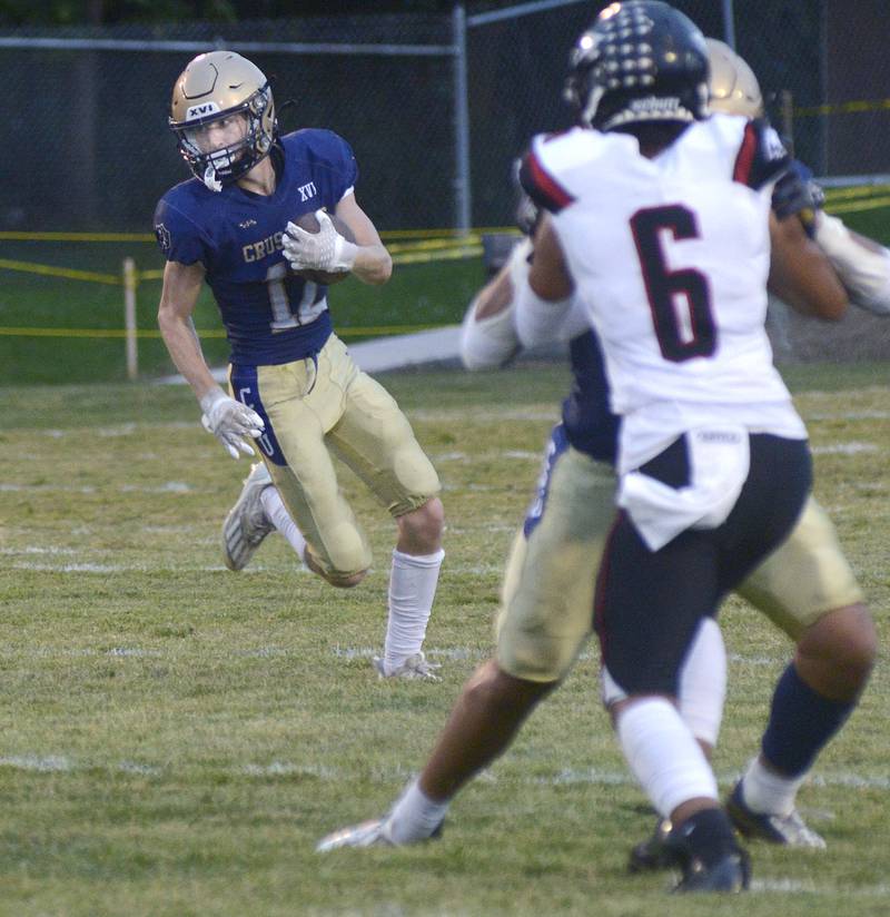 Marquette’s Rush Keefer looks for an opening against Aurora Christian on a run in the 2nd quarter Friday at Marquette.