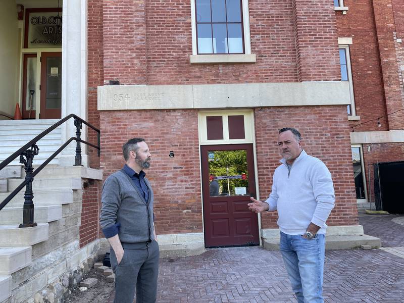 Woodstock City Planner Darrell Moore (left) and Woodstock Mayor Mike Turner (right) discuss the ongoing changes at the Old Courthouse and Sheriff's House on Thursday, May 25, 2023, in Woodstock.