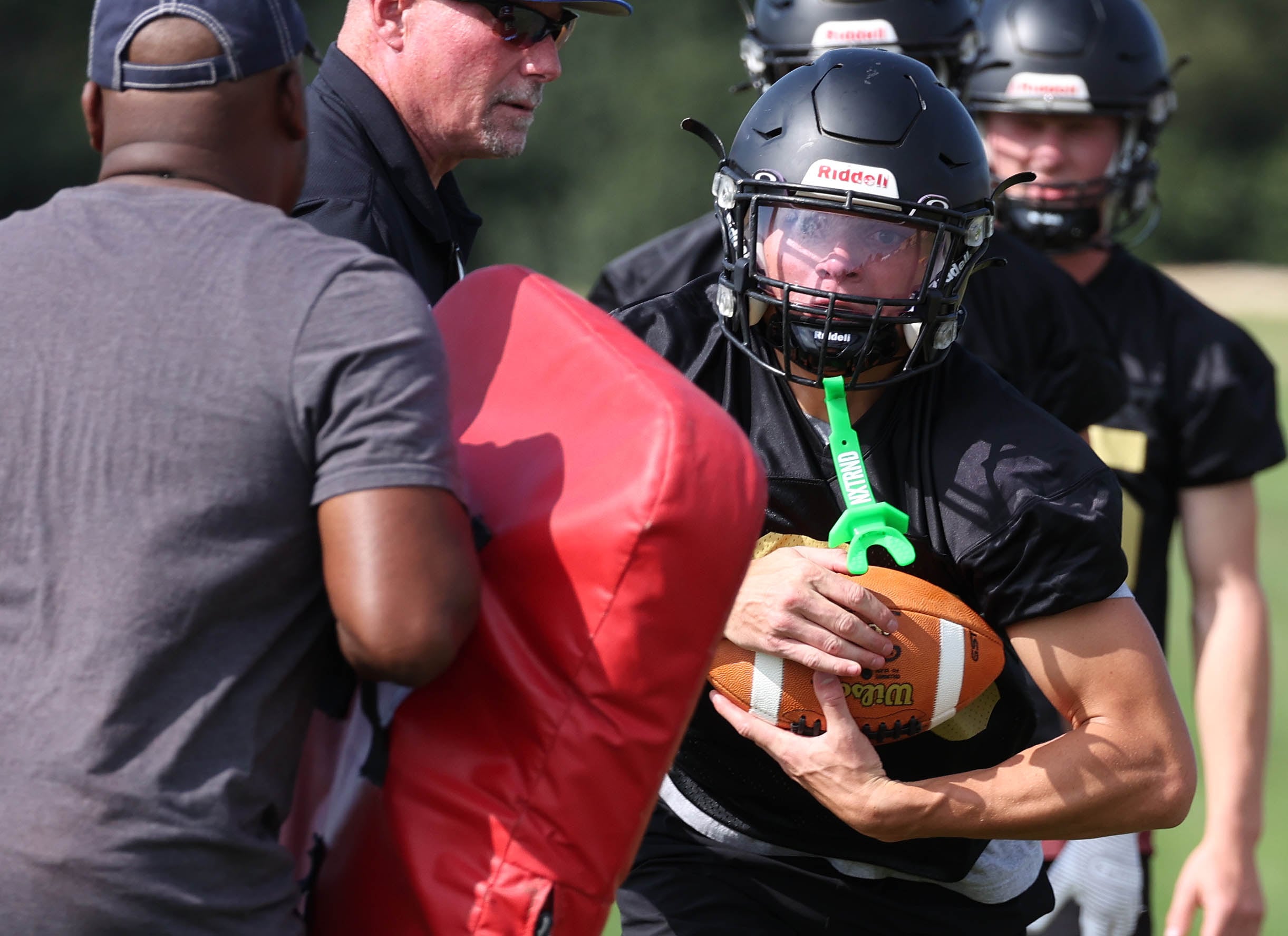 Sycamore’s Dylan Hodges carries the ball in a drill Monday, Aug. 12, 2024, during the first practice of the regular season.