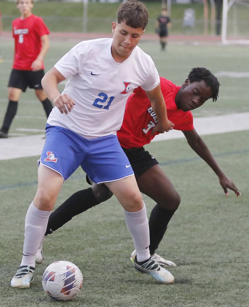 Larkin's Angel Lizarazo tries to control the ball  in front of Huntley's Mathieu Tchoutan during a nonconference soccer match on Thursday, Sept. 5, 2024, at Huntley High School.