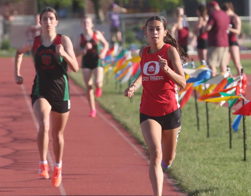 Ottawa's Shaylen Quinn and L-P's Ashlee Lord run in the 800 meter race during the Interstate 8 conference track meet on Friday, May 3, 2024 at the L-P Athletic Complex in La Salle.