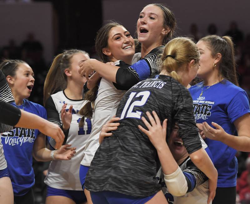 St. Francis’ Emma Delaney and Addy Horner celebrate with teammates after defeating Lincoln in the Class 3A girls volleyball state championship match at Illinois State University in Normal on Saturday, October 11, 2023.