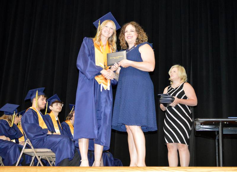 Polo Community High School Class of 2024 valedictorian Sydnei Rahn accepts her diploma from PCHS Board of Education member Jennifer Grobe during the commencement ceremony on Sunday, May 19, 2024.