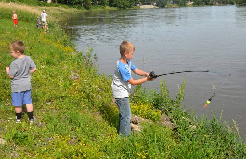 Morse Reynolds, 8 of Prophetstown, casts his line into the Rock River at the 18th annual Dick Brown Fishing Derby at Prophetstown State Park on Saturday, June 15, 2024.