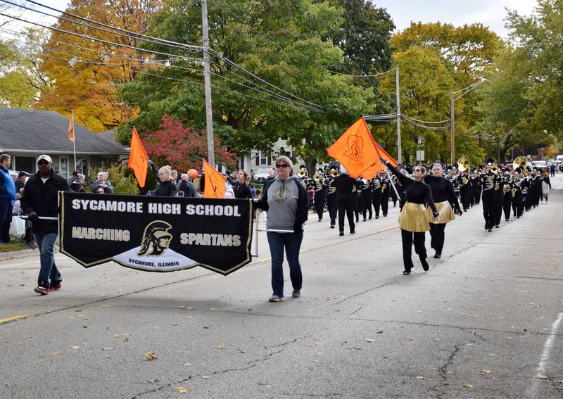 The Sycamore High School Marching Spartans performs during the Sycamore Pumpkin Festival Parade, held Sunday, Oct. 31, 2021.