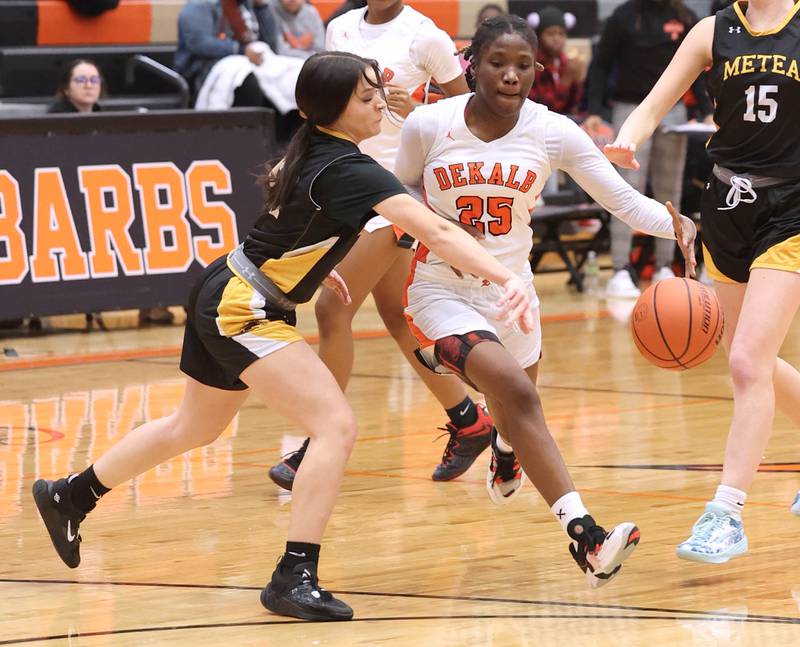 DeKalb’s Kezaria Mitchell tries to get around Metea Valley's Reese Valha during their game Friday, Jan. 19, 2024, at DeKalb High School.