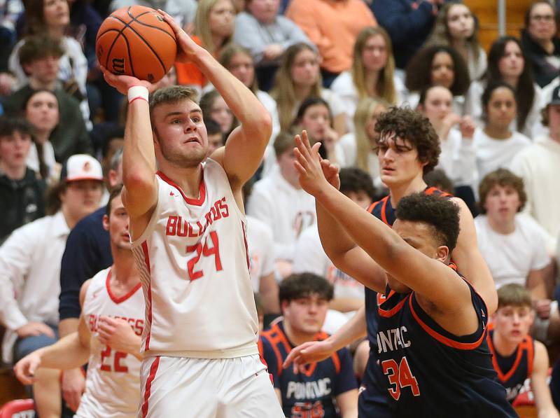 Streator's Landon Muntz looks to shoot a jump shot over Pontiac's Riley Johnson during the Class 3A Regional semifinal game on Wednesday, Feb. 22, 2024 at Pops Dale Gymnasium.